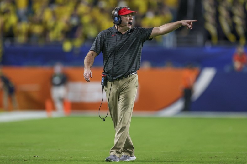 Dec 31, 2021; Miami Gardens, Florida, USA; Georgia Bulldogs head coach Kirby Smart gestures in the fourth quarter against the Michigan Wolverines during the Orange Bowl college football CFP national semifinal game at Hard Rock Stadium. Mandatory Credit: Sam Navarro-USA TODAY Sports