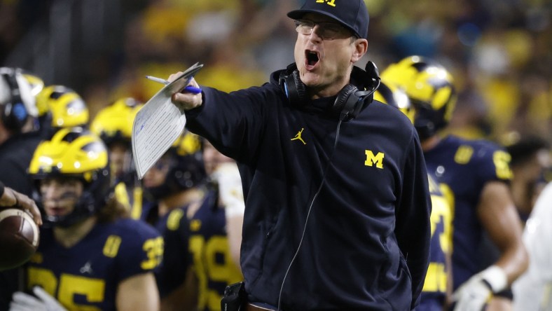 Dec 31, 2021; Miami Gardens, Florida, USA; Michigan Wolverines head coach Jim Harbaugh reacts from the sideline during the second half in the Orange Bowl college football CFP national semifinal game against the Georgia Bulldogs at Hard Rock Stadium. Mandatory Credit:  Rhona Wise-USA TODAY Sports