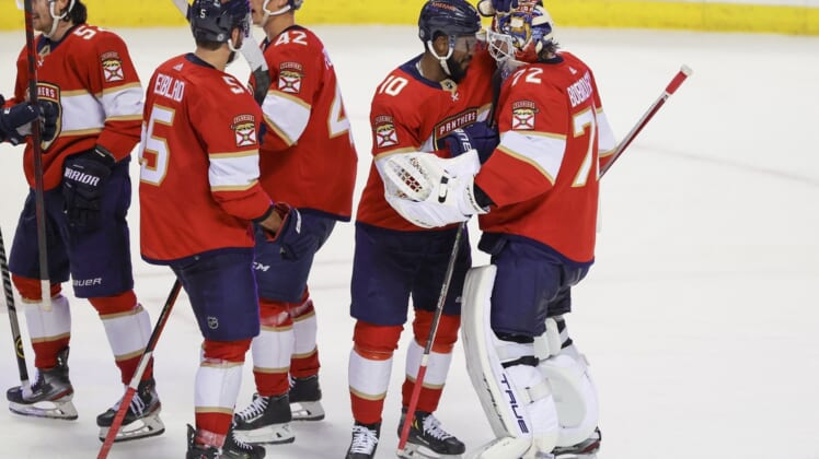 Jan 1, 2022; Sunrise, Florida, USA; Florida Panthers left wing Anthony Duclair (10) and goaltender Sergei Bobrovsky (72) celebrate after winning the game against the Montreal Canadiens at FLA Live Arena. Mandatory Credit: Sam Navarro-USA TODAY Sports