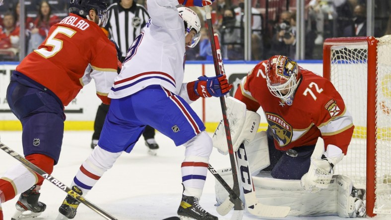 Jan 1, 2022; Sunrise, Florida, USA; Florida Panthers goaltender Sergei Bobrovsky (72) saves a shot by Montreal Canadiens left wing Rafael Harvey-Pinard (49) during the first period at FLA Live Arena. Mandatory Credit: Sam Navarro-USA TODAY Sports