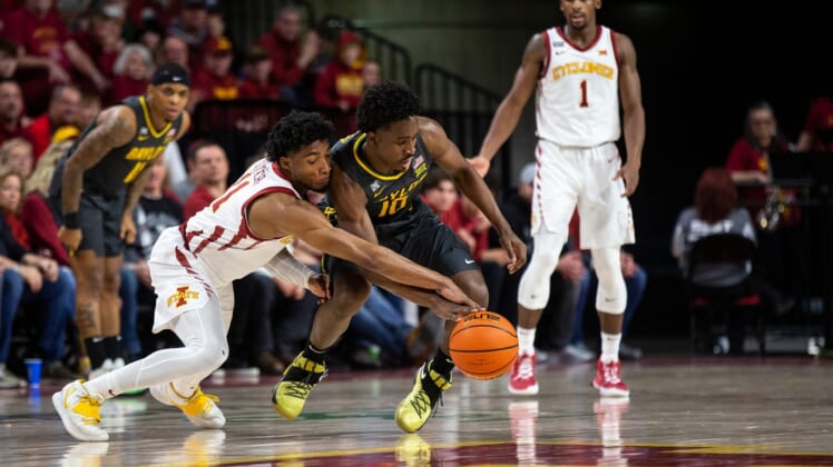 Iowa State's Tyrese Hunter and Baylor's Adam Flagler chase the ball during the Iowa State men's basketball game against No. 1 Baylor, on Saturday Jan. 1, 2022, at Hilton Coliseum, in Ames. The Cyclones fell to the Bears 77-72.