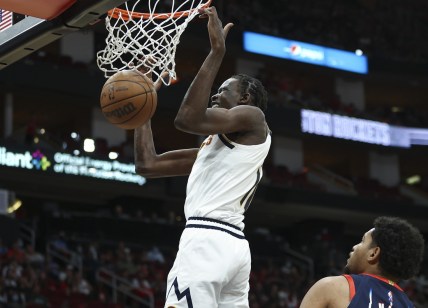 Jan 1, 2022; Houston, Texas, USA; Denver Nuggets center Bol Bol (10) dunks the ball during the fourth quarter against the Houston Rockets at Toyota Center. Mandatory Credit: Troy Taormina-USA TODAY Sports
