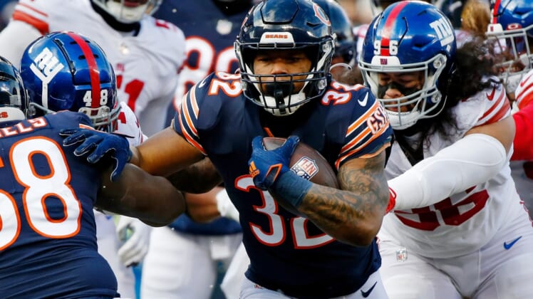Jan 2, 2022; Chicago, Illinois, USA; Chicago Bears running back David Montgomery (32) runs with the ball for a touchdown against the New York Giants during the first half at Soldier Field. Mandatory Credit: Jon Durr-USA TODAY Sports