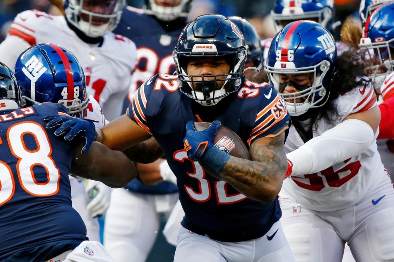 Jan 2, 2022; Chicago, Illinois, USA; Chicago Bears running back David Montgomery (32) runs with the ball for a touchdown against the New York Giants during the first half at Soldier Field. Mandatory Credit: Jon Durr-USA TODAY Sports
