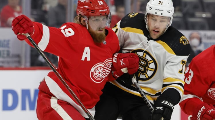Jan 2, 2022; Detroit, Michigan, USA;  Detroit Red Wings defenseman Marc Staal (18) and Boston Bruins left wing Taylor Hall (71) fight for position in the first period at Little Caesars Arena. Mandatory Credit: Rick Osentoski-USA TODAY Sports