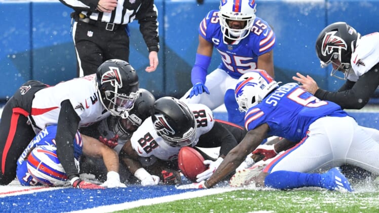 Jan 2, 2022; Orchard Park, New York, USA; Atlanta Falcons wide receiver Frank Darby (88) and teammates struggle to recover a fumble by Buffalo Bills wide receiver Marquez Stevenson (5) on a punt for a safety in the first quarter at Highmark Stadium. Mandatory Credit: Mark Konezny-USA TODAY Sports