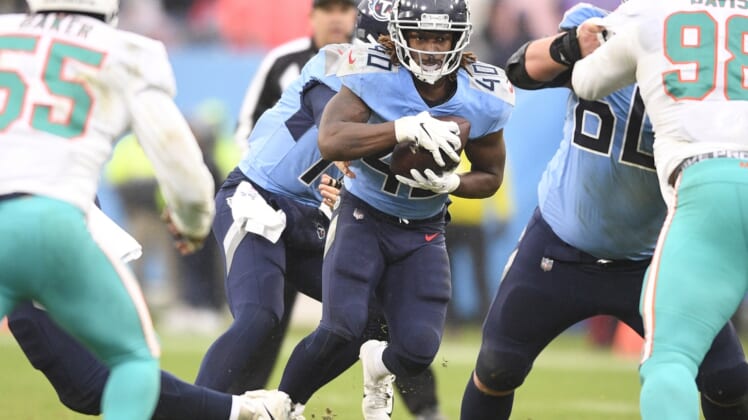 Jan 2, 2022; Nashville, Tennessee, USA;  Tennessee Titans running back Dontrell Hilliard(40) runs the ball against the Miami Dolphins during the first half at Nissan Stadium. Mandatory Credit: Steve Roberts-USA TODAY Sports