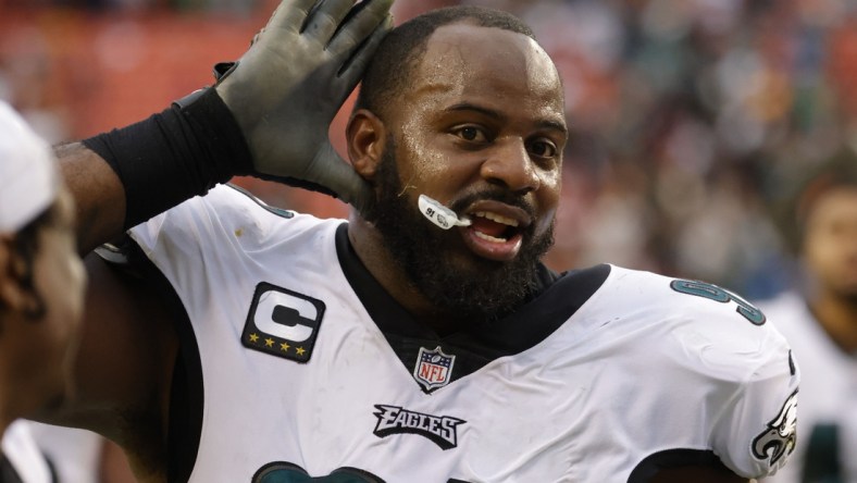 Jan 2, 2022; Landover, Maryland, USA; Philadelphia Eagles defensive tackle Fletcher Cox (91) celebrates while leaving the field after the game against the Washington Football Team at FedExField. Mandatory Credit: Geoff Burke-USA TODAY Sports