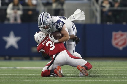 Jan 2, 2022; Arlington, Texas, USA; Arizona Cardinals safety Budda Baker (3) tackles Dallas Cowboys tight end Dalton Schultz (86) in the second quarter at AT&T Stadium. Mandatory Credit: Tim Heitman-USA TODAY Sports