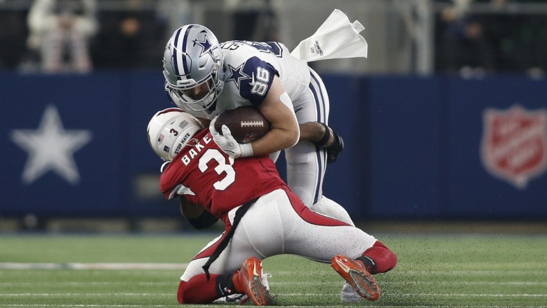 Jan 2, 2022; Arlington, Texas, USA; Arizona Cardinals safety Budda Baker (3) tackles Dallas Cowboys tight end Dalton Schultz (86) in the second quarter at AT&T Stadium. Mandatory Credit: Tim Heitman-USA TODAY Sports