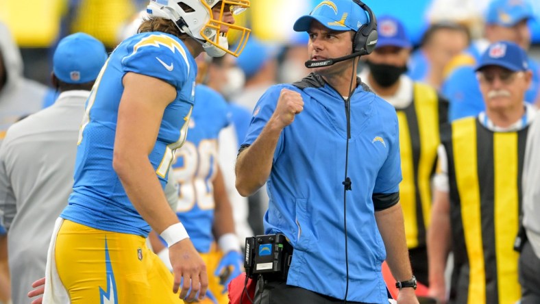 Jan 2, 2022; Inglewood, California, USA; Los Angeles Chargers head coach Brandon Staley celebrates with Los Angeles Chargers quarterback Justin Herbert (10) after a touchdown in the second half the game against the Denver Broncos at SoFi Stadium. Mandatory Credit: Jayne Kamin-Oncea-USA TODAY Sports