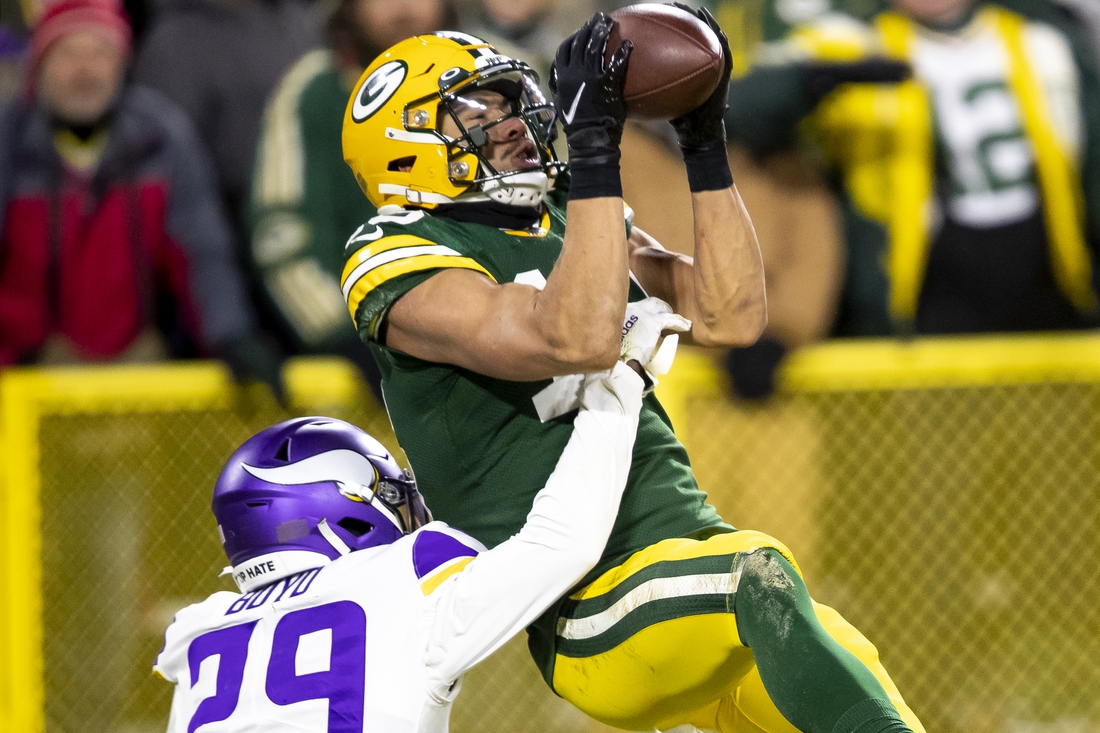 Packers clinch top seed in NFC with rout of Vikings