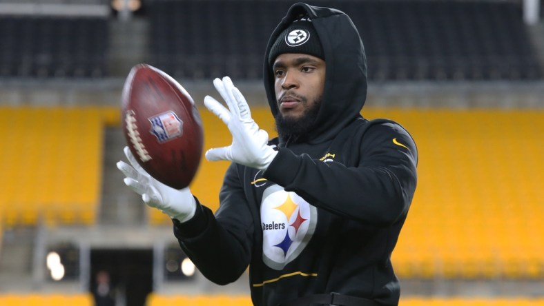 Jan 3, 2022; Pittsburgh, Pennsylvania, USA; Pittsburgh Steelers wide receiver Diontae Johnson (18) warms up before he game against the Cleveland Browns at Heinz Field. Mandatory Credit: Charles LeClaire-USA TODAY Sports