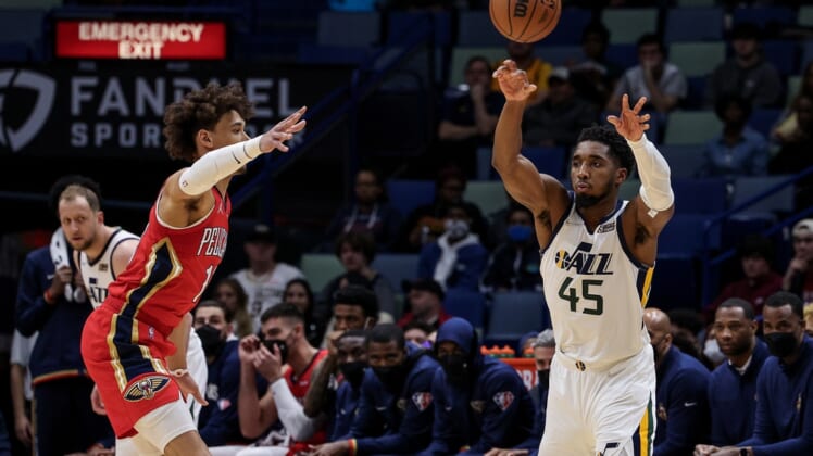 Jan 3, 2022; New Orleans, Louisiana, USA;  Utah Jazz guard Donovan Mitchell (45) passes the ball against New Orleans Pelicans center Jaxson Hayes (10) during the first half at the Smoothie King Center. Mandatory Credit: Stephen Lew-USA TODAY Sports