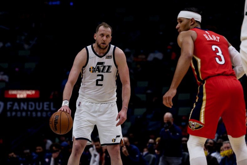 Jan 3, 2022; New Orleans, Louisiana, USA;  Utah Jazz guard Joe Ingles (2) dribbles against New Orleans Pelicans guard Josh Hart (3) during the second half at the Smoothie King Center. Mandatory Credit: Stephen Lew-USA TODAY Sports