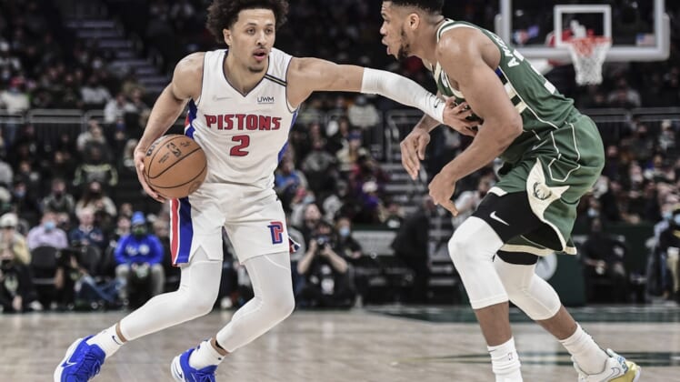 Jan 3, 2022; Milwaukee, Wisconsin, USA;  Detroit Pistons guard Cade Cunningham (2) drives for the basket against Milwaukee Bucks forward Giannis Antetokounmpo (34) in the fourth quarter at Fiserv Forum. Mandatory Credit: Benny Sieu-USA TODAY Sports