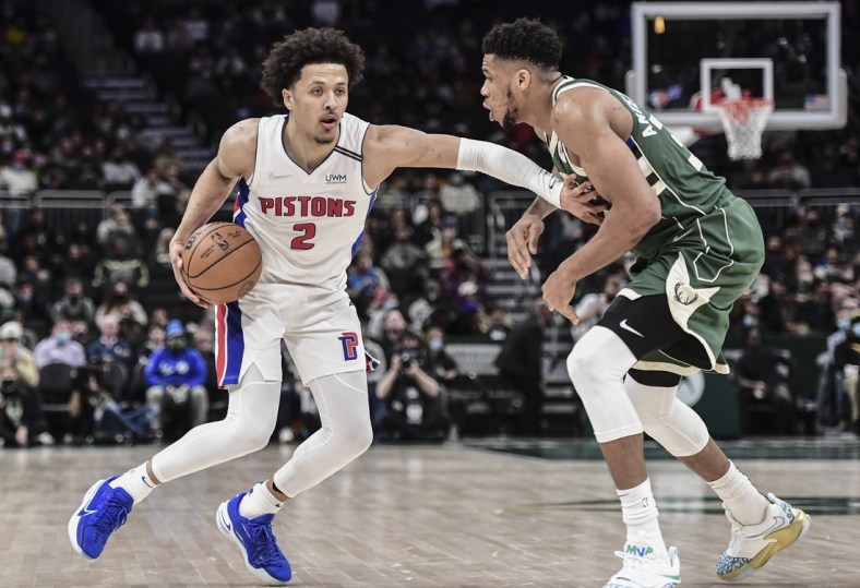 Jan 3, 2022; Milwaukee, Wisconsin, USA;  Detroit Pistons guard Cade Cunningham (2) drives for the basket against Milwaukee Bucks forward Giannis Antetokounmpo (34) in the fourth quarter at Fiserv Forum. Mandatory Credit: Benny Sieu-USA TODAY Sports