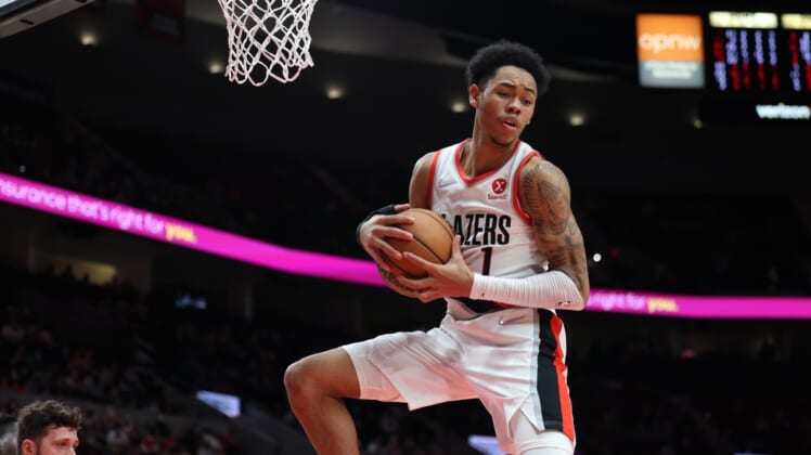 Jan 3, 2022; Portland, Oregon, USA;  Portland Trail Blazers guard Anfernee Simons (1) grabs a rebound in the closing seconds of the second half against the Atlanta Hawks at Moda Center. Mandatory Credit: Jaime Valdez-USA TODAY Sports
