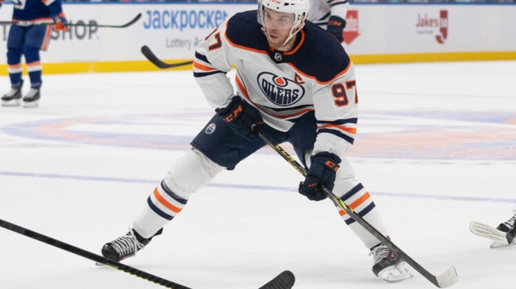 Jan 1, 2022; Elmont, New York, USA; Edmonton Oilers center Connor McDavid (97) skates with the puck during the first period against the New York Islanders at UBS Arena. Mandatory Credit: Gregory Fisher-USA TODAY Sports