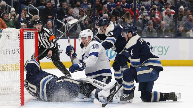 Jan 4, 2022; Columbus, Ohio, USA; Tampa Bay Lightning right wing Corey Perry (10) puts the rebound past Columbus Blue Jackets goalie Joonas Korpisalo (70) for a goal during the first period at Nationwide Arena. Mandatory Credit: Russell LaBounty-USA TODAY Sports