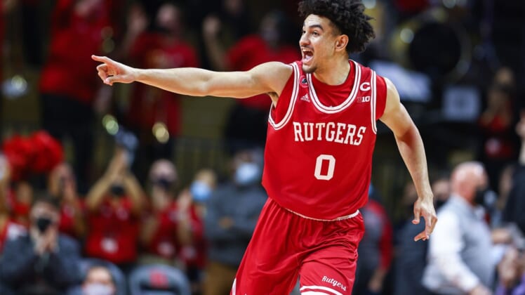 Jan 4, 2022; Piscataway, New Jersey, USA; Rutgers Scarlet Knights guard Geo Baker (0) reacts after a three point basket against the Michigan Wolverines during the first half at Jersey Mike's Arena. Mandatory Credit: Vincent Carchietta-USA TODAY Sports