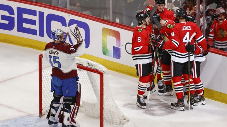 Jan 4, 2022; Chicago, Illinois, USA; Chicago Blackhawks center Jonathan Toews (19) celebrates with teammates after scoring against the Colorado Avalanche during the second period at United Center. Mandatory Credit: Kamil Krzaczynski-USA TODAY Sports