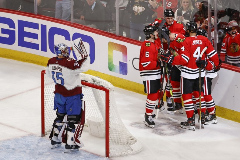 Jan 4, 2022; Chicago, Illinois, USA; Chicago Blackhawks center Jonathan Toews (19) celebrates with teammates after scoring against the Colorado Avalanche during the second period at United Center. Mandatory Credit: Kamil Krzaczynski-USA TODAY Sports