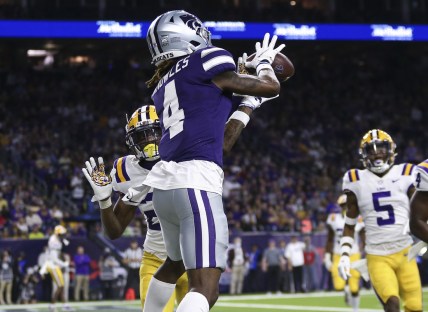 Jan 4, 2022; Houston, TX, USA; Kansas State Wildcats wide receiver Malik Knowles (4) makes a reception for a touchdown as LSU Tigers defensive back Damarius McGhee (26) defends during the second quarter during the 2022 Texas Bowl at NRG Stadium. Mandatory Credit: Troy Taormina-USA TODAY Sports