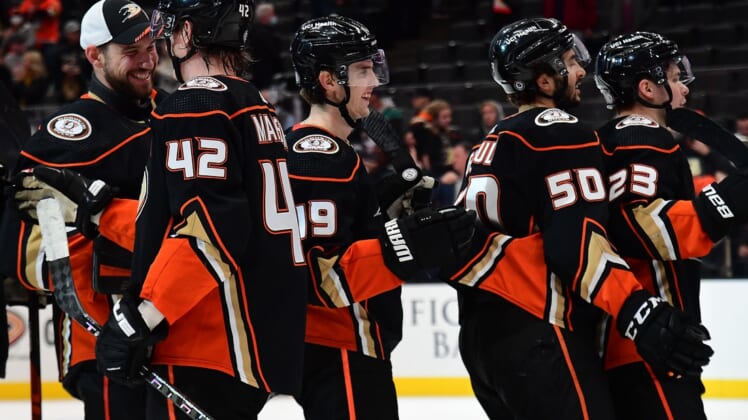 Jan 4, 2022; Anaheim, California, USA; Anaheim Ducks right wing Troy Terry (19) and the Ducks celebrate the victory against the Philadelphia Flyers at Honda Center. Mandatory Credit: Gary A. Vasquez-USA TODAY Sports
