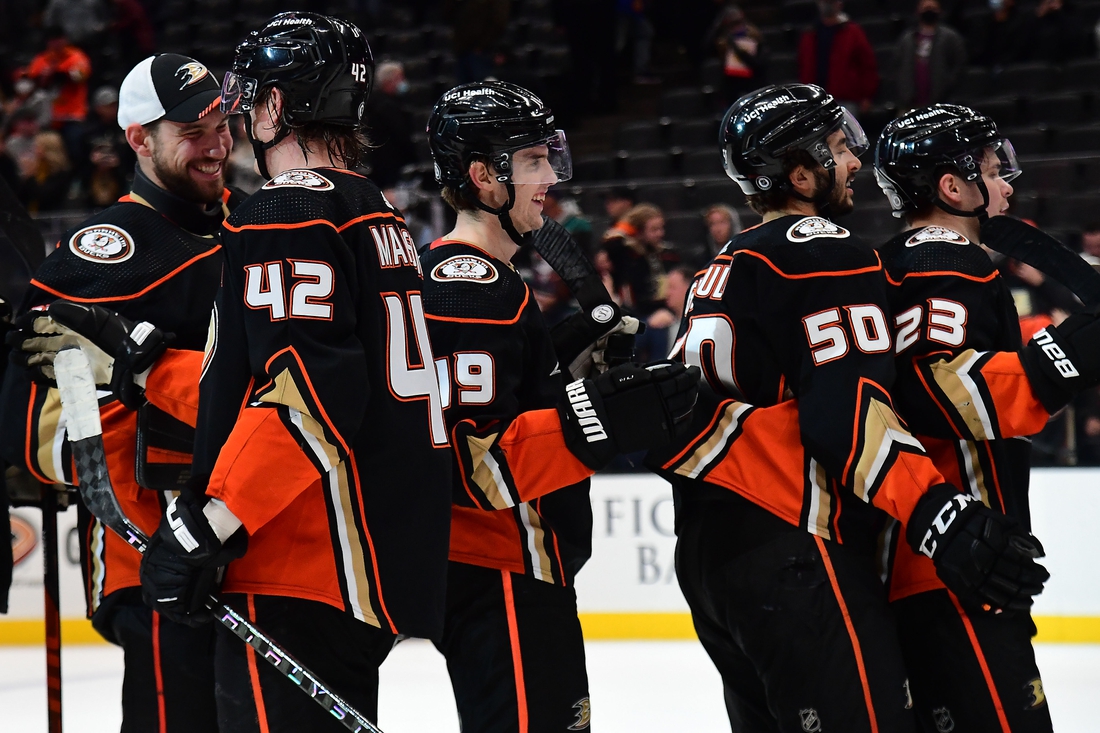 Jan 4, 2022; Anaheim, California, USA; Anaheim Ducks right wing Troy Terry (19) and the Ducks celebrate the victory against the Philadelphia Flyers at Honda Center. Mandatory Credit: Gary A. Vasquez-USA TODAY Sports