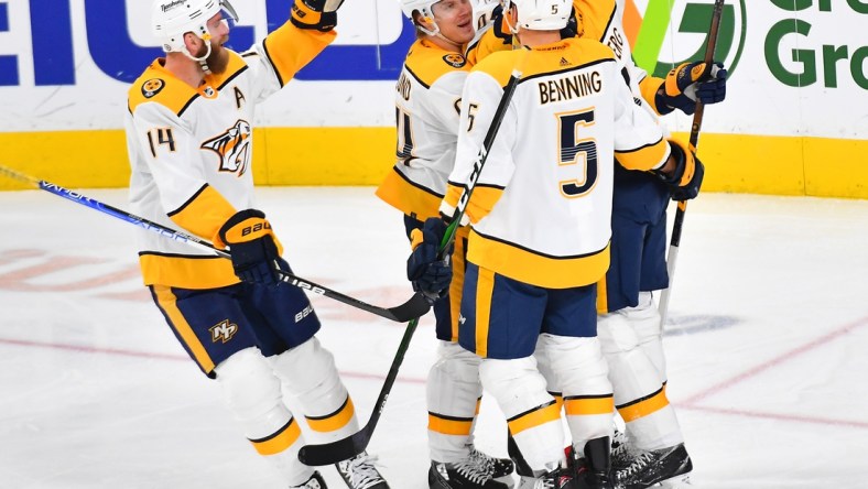 Jan 4, 2022; Las Vegas, Nevada, USA; Nashville Predators players celebrate a goal scored by Nashville Predators left wing Filip Forsberg (9) during the third period against the Vegas Golden Knights at T-Mobile Arena. Mandatory Credit: Stephen R. Sylvanie-USA TODAY Sports