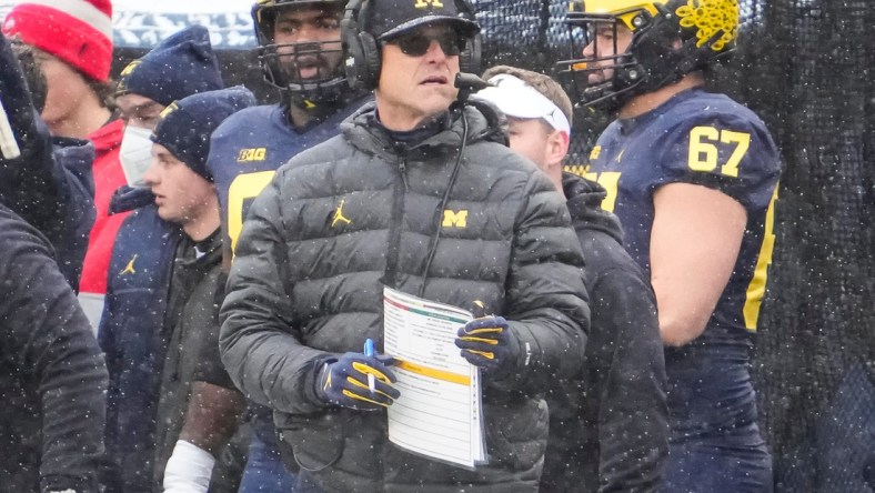 Michigan Wolverines head coach Jim Harbaugh stands on the sideline during the NCAA football game at Michigan Stadium in Ann Arbor on Monday, Nov. 29, 2021.Ohio State Buckeyes At Michigan Wolverines