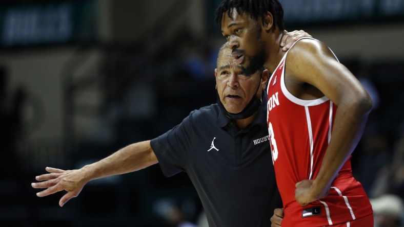 Jan 5, 2022; Tampa, Florida, USA; Houston Cougars head coach Kelvin Sampson and forward J'Wan Roberts (13) during the second half against the South Florida Bulls at Yuengling Center. Mandatory Credit: Kim Klement-USA TODAY Sports