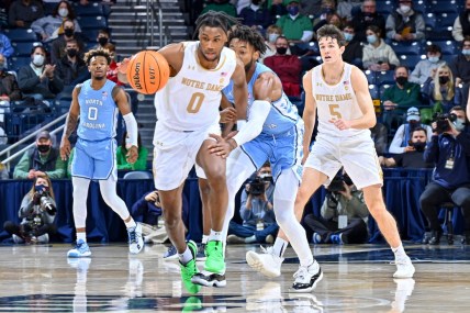 Jan 5, 2022; South Bend, Indiana, USA; Notre Dame Fighting Irish guard Blake Wesley (0) grabs a loose ball in the first half against the North Carolina Tar Heels at the Purcell Pavilion. Mandatory Credit: Matt Cashore-USA TODAY Sports