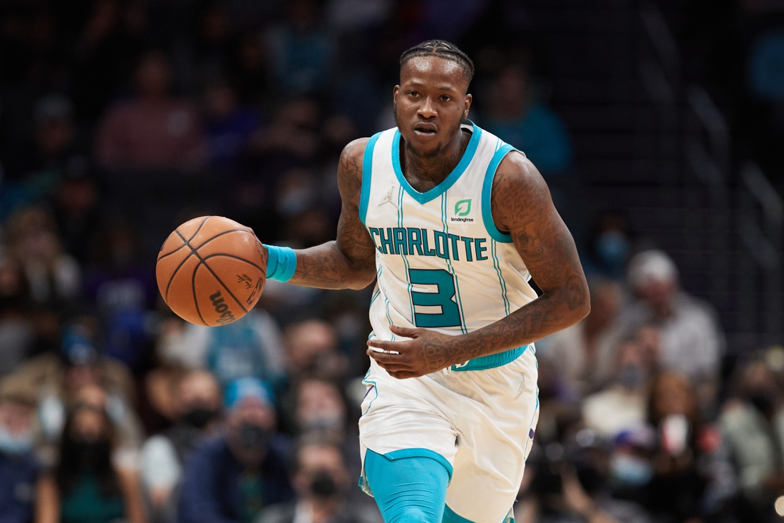 Jan 5, 2022; Charlotte, North Carolina, USA; Charlotte Hornets guard Terry Rozier (3) brings the ball up the court during second half action against the Detroit Pistons at Spectrum Center. Mandatory Credit: Brian Westerholt-USA TODAY Sports