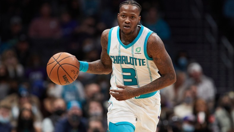 Jan 5, 2022; Charlotte, North Carolina, USA; Charlotte Hornets guard Terry Rozier (3) brings the ball up the court during second half action against the Detroit Pistons at Spectrum Center. Mandatory Credit: Brian Westerholt-USA TODAY Sports