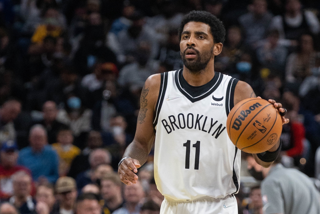 Jan 5, 2022; Indianapolis, Indiana, USA; Brooklyn Nets guard Kyrie Irving (11) dribbles the ball in the second half against the Indiana Pacers  at Gainbridge Fieldhouse. Mandatory Credit: Trevor Ruszkowski-USA TODAY Sports