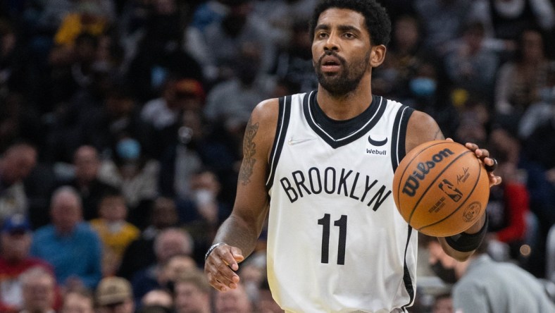 Jan 5, 2022; Indianapolis, Indiana, USA; Brooklyn Nets guard Kyrie Irving (11) dribbles the ball in the second half against the Indiana Pacers  at Gainbridge Fieldhouse. Mandatory Credit: Trevor Ruszkowski-USA TODAY Sports