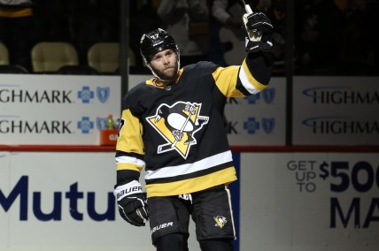 Jan 5, 2022; Pittsburgh, Pennsylvania, USA;  Pittsburgh Penguins right wing Bryan Rust (17) reacts after being named first star of the game against the St. Louis Blues at PPG Paints Arena. The Penguins won 5-3. Mandatory Credit: Charles LeClaire-USA TODAY Sports