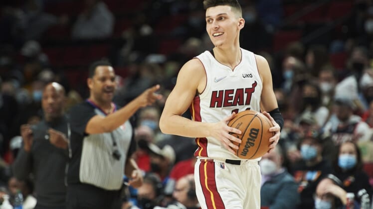 Jan 5, 2022; Portland, Oregon, USA; Miami Heat guard Tyler Herro (14) is called for an offensive foul during the second half against the Portland Trail Blazers at Moda Center. The Heat won the game 115-109. Mandatory Credit: Troy Wayrynen-USA TODAY Sports