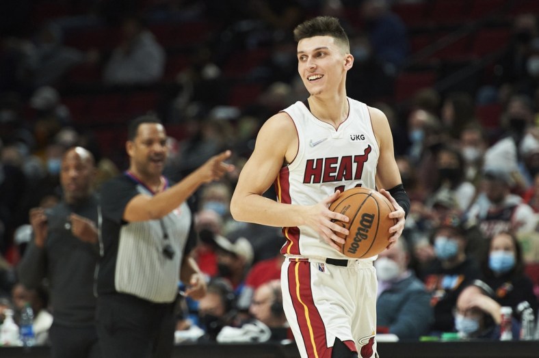 Jan 5, 2022; Portland, Oregon, USA; Miami Heat guard Tyler Herro (14) is called for an offensive foul during the second half against the Portland Trail Blazers at Moda Center. The Heat won the game 115-109. Mandatory Credit: Troy Wayrynen-USA TODAY Sports