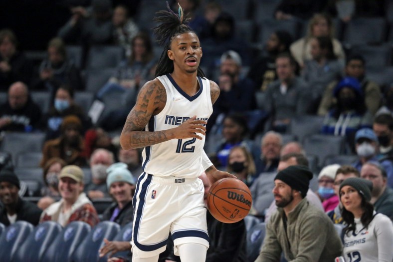 Jan 6, 2022; Memphis, Tennessee, USA; Memphis Grizzles guard Ja Morant (12) dribbles up the court during the second half against the Detroit Pistons at FedExForum. Mandatory Credit: Petre Thomas-USA TODAY Sports