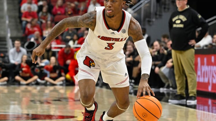 Dec 29, 2021; Louisville, Kentucky, USA;  Louisville Cardinals guard El Ellis (3) dribbles against the Wake Forest Demon Deacons during the second half at KFC Yum! Center. Louisville defeated Wake Forest 73-69. Mandatory Credit: Jamie Rhodes-USA TODAY Sports