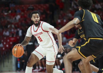 Jan 8, 2022; Houston, Texas, USA; Houston Cougars guard Kyler Edwards (11) controls the ball during the first half against the Wichita State Shockers at Fertitta Center. Mandatory Credit: Troy Taormina-USA TODAY Sports