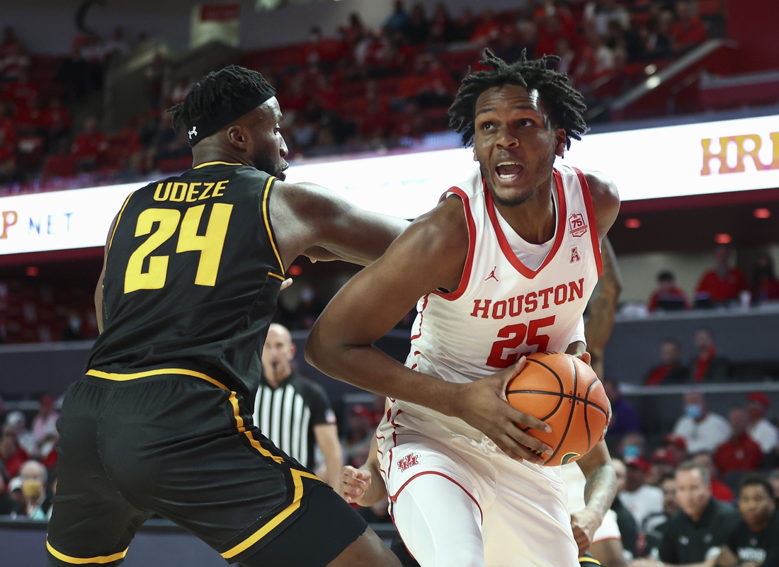 Houston center Josh Carlton (25) works to the basket as Oklahoma