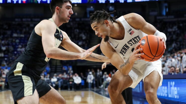 Jan 8, 2022; University Park, Pennsylvania, USA; Penn State Nittany Lions forward Seth Lundy (1) holds onto the ball as Purdue Boilermakers guard Ethan Morton (25) defends during the first half at Bryce Jordan Center. Mandatory Credit: Matthew OHaren-USA TODAY Sports