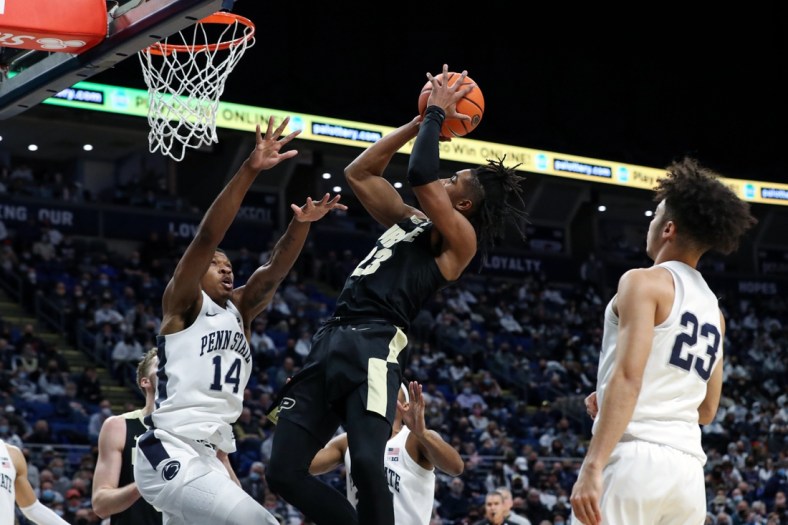 Jan 8, 2022; University Park, Pennsylvania, USA; Purdue Boilermakers guard Jaden Ivey (23) shoots the ball as Penn State Nittany Lions forward Jalanni White (14) defends during the second half at Bryce Jordan Center. Purdue defeated Penn State 74-67. Mandatory Credit: Matthew OHaren-USA TODAY Sports