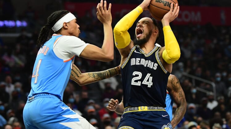 Jan 8, 2022; Los Angeles, California, USA; Memphis Grizzlies forward Dillon Brooks (24) reacts suffering an injury while moving to the basket against Los Angeles Clippers guard Brandon Boston Jr. (4) during the first half at Crypto.com Arena. Mandatory Credit: Gary A. Vasquez-USA TODAY Sports