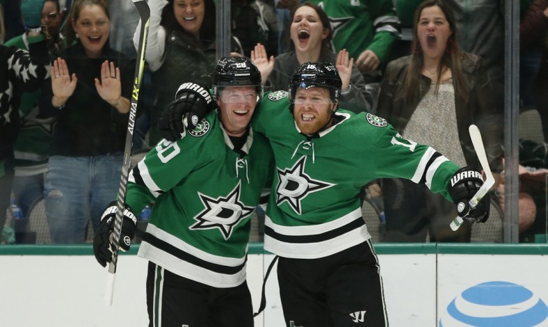 Jan 8, 2022; Dallas, Texas, USA; Dallas Stars defenseman Ryan Suter (20) and center Joe Pavelski (16) celebrate a goal in the third period against the Pittsburgh Penguins at American Airlines Center. Mandatory Credit: Tim Heitman-USA TODAY Sports