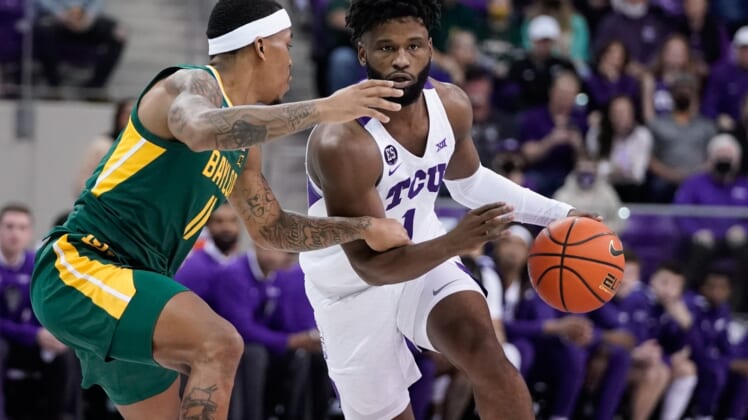 Jan 8, 2022; Fort Worth, Texas, USA; TCU Horned Frogs guard Mike Miles (1) controls the ball against Baylor Bears guard James Akinjo (11) during the first half at Ed and Rae Schollmaier Arena. Mandatory Credit: Chris Jones-USA TODAY Sports